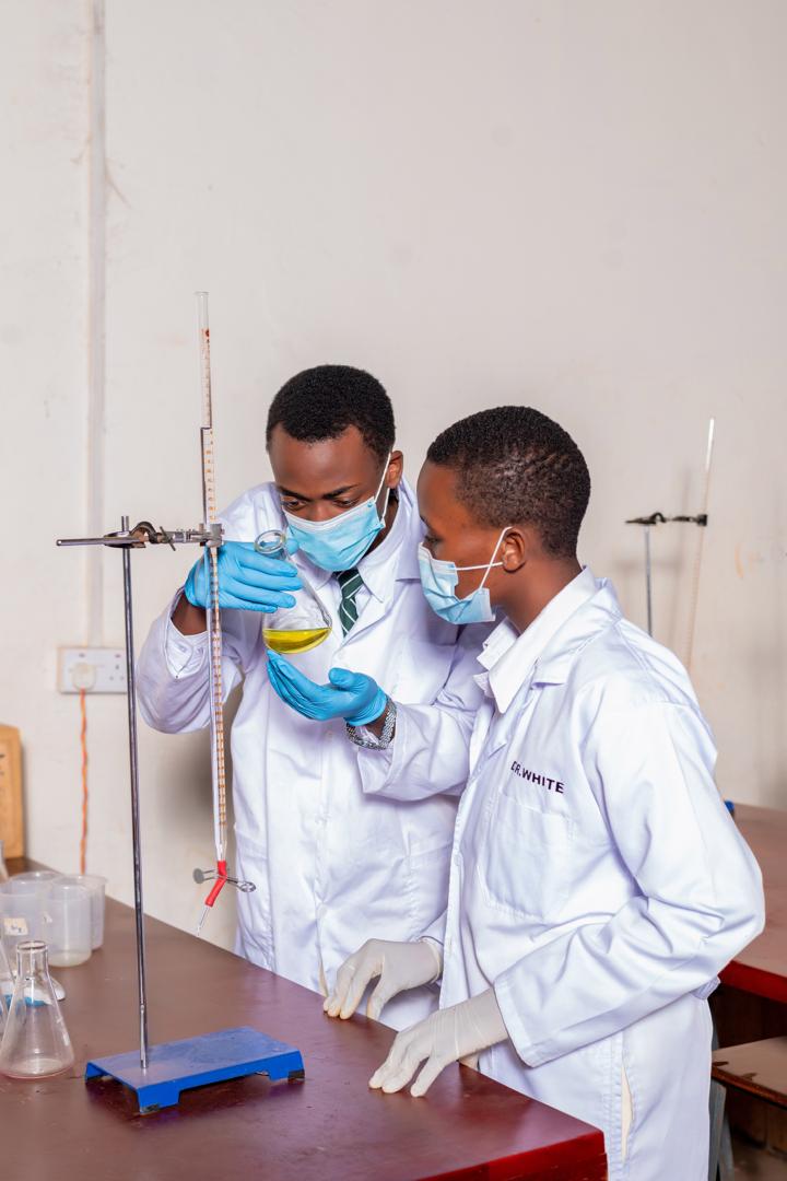 Bright Future students carrying out a chemistry experiment in the school laboratory