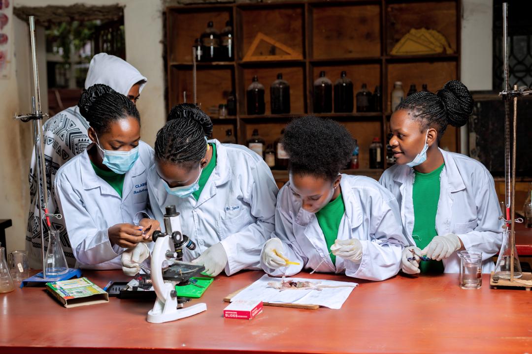 Bright Future students using microscopes during a biology practical